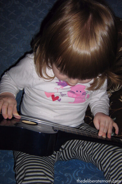 Enjoying this moment of my daughter playing the ukulele.
