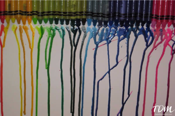 Crayons + heat = Melted crayon art! This art project is a fun one to do with the kiddos!