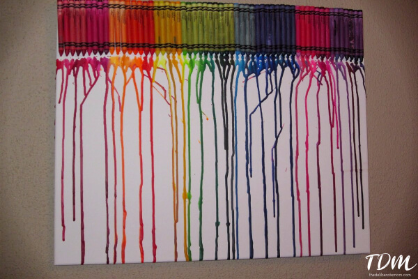 Crayons + heat = Melted crayon art! This art project is a fun one to do with the kiddos!