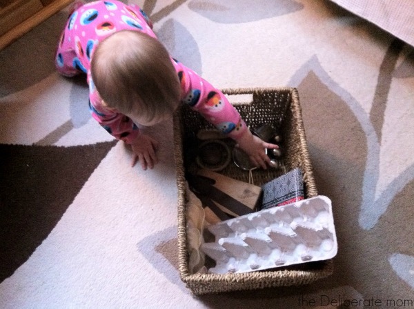 Infant playing with a treasure basket: Heuristic play.