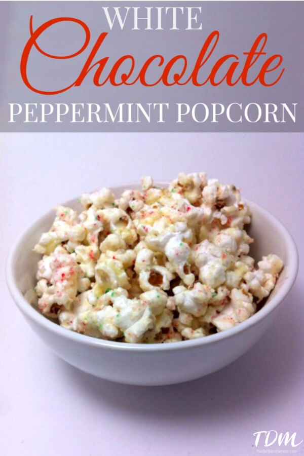 White Chocolate Peppermint Popcorn - this is ADDICTIVE! Popcorn is coated with white chocolate and sprinkled with crushed candy canes. A fabulous Christmas treat!