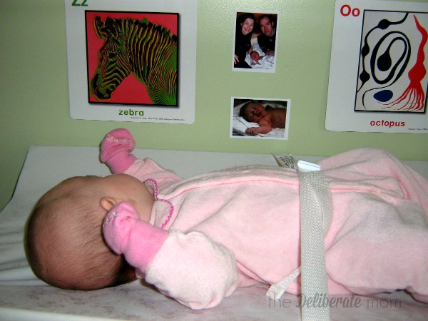 Hang pictures by the change table to make diaper changes more interesting. #parenting #tips #babies #toddlers