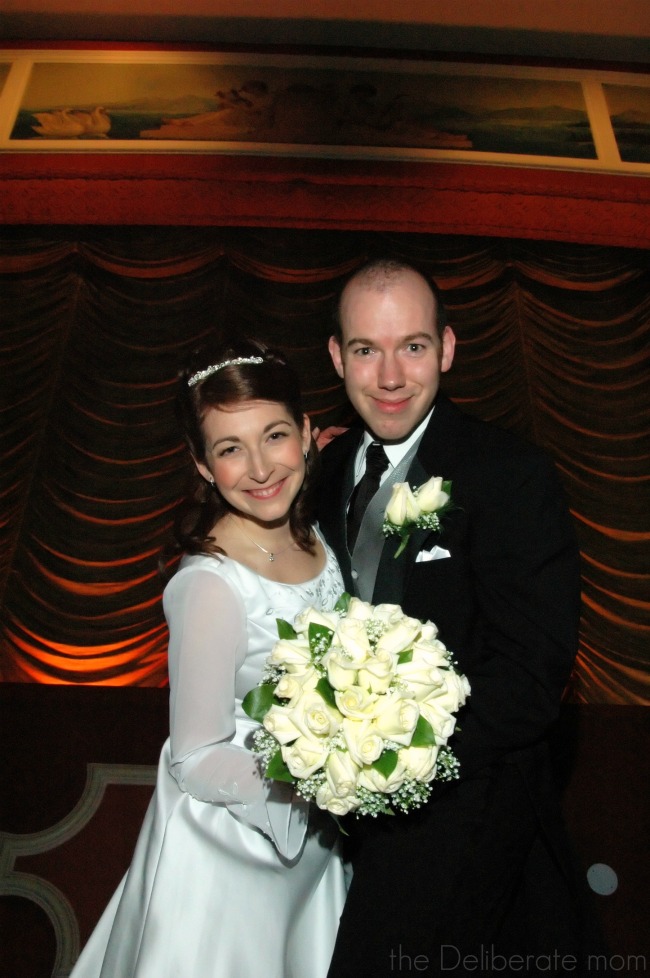 Formal wedding photos in a historic movie theatre.