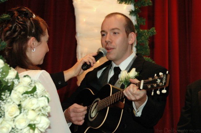 My husband singing a song for his wedding vows.